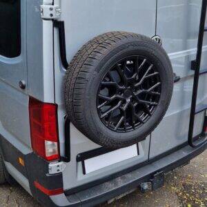 Gloss black alloy wheel fitted to spare wheel carrier.